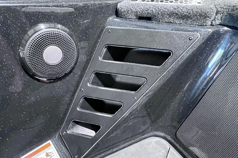 Slide: The Image of Speaker and vent detail on 2026 Skeeter FXR20 boat interior. - 14