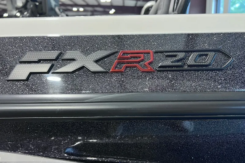 Slide: The Image of 2026 Skeeter FXR20 logo on a glittery black surface, showcasing sleek design. - 2