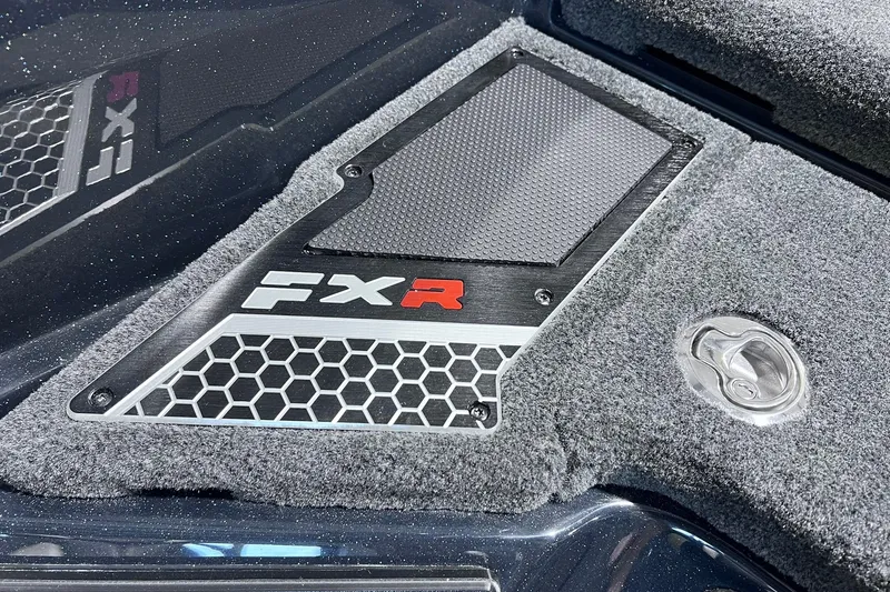 Slide: The Image of 2026 Skeeter FXR20 boat deck with hexagonal pattern and FXR logo detail. - 8