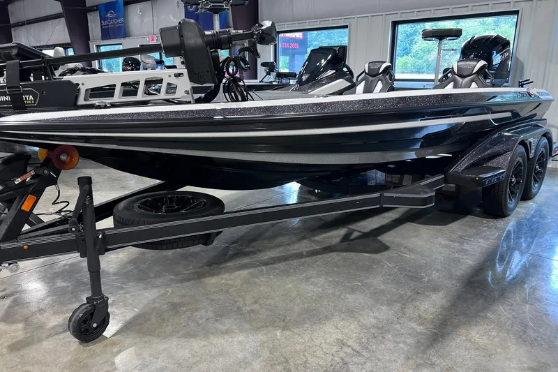 The Image of 2026 Skeeter FXR20 boat on trailer in showroom, featuring sleek design and modern equipment. - 1