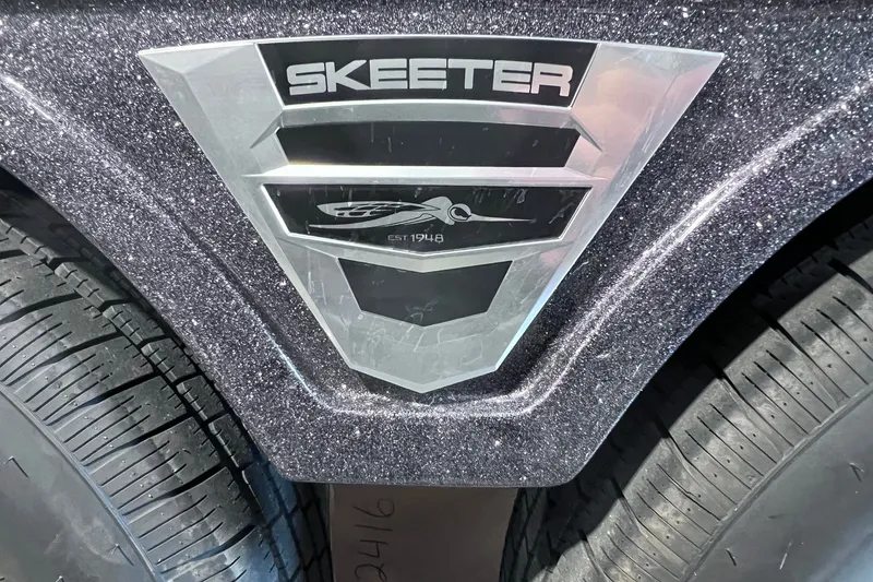 Slide: The Image of Close-up of 2026 Skeeter FXR20 logo on a metallic surface with tire detail. - 17