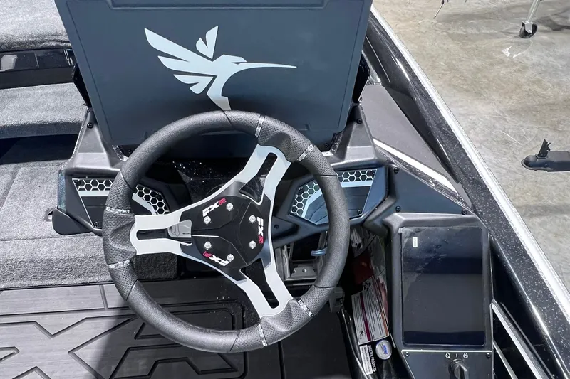 Slide: The Image of Steering wheel of 2026 Skeeter FXR20 boat with modern dashboard design. - 12