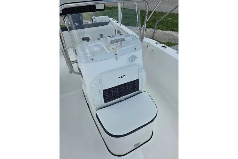 Slide: The Image of 2024 Tidewater 180 CC Adventure boat interior with seating and console details. - 10