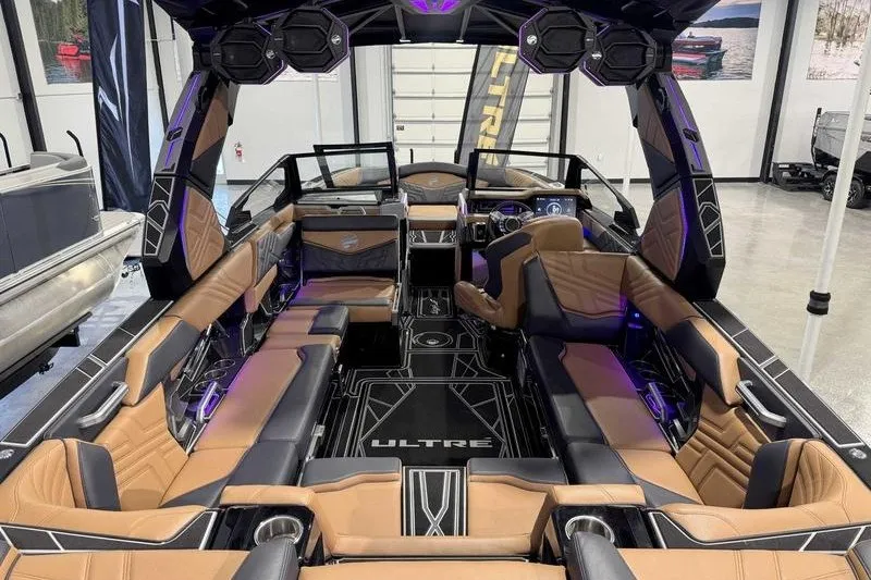 Slide: The Image of Luxurious interior of 2027 Tigé 25ZX boat with modern seating and advanced audio system. - 17
