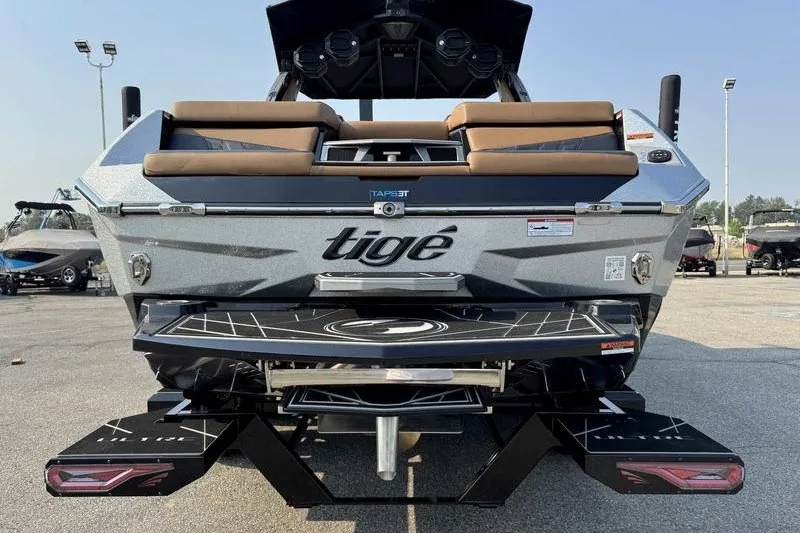 Slide: The Image of 2027 Tigé 25ZX boat rear view with sleek design and modern features. - 14