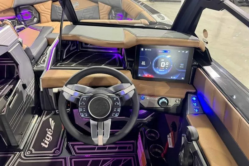 Slide: The Image of 2027 Tigé 25ZX boat interior with modern dashboard and touchscreen display. - 5
