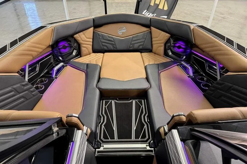 Slide: The Image of Luxurious interior of 2027 Tigé 25ZX boat with stylish seating and ambient lighting. - 8