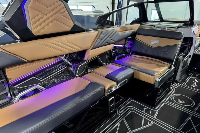 Slide: The Image of Luxurious interior of 2027 Tigé 25ZX boat with modern seating and ambient lighting. - 3