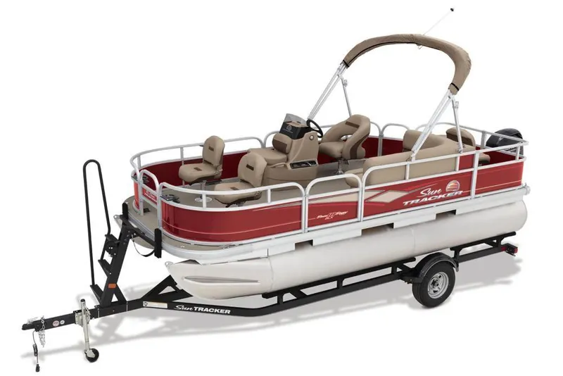 Slide: The Image of A red pontoon boat with beige canopy and seats on a trailer. - 14