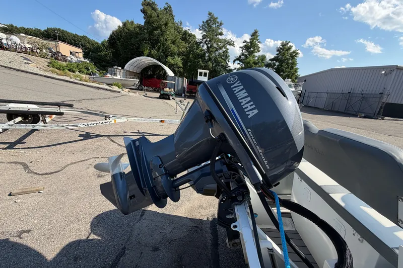Slide: The Image of Highfield Classic 380 FCT 2025 with Yamaha outboard motor in a sunny outdoor setting. - 8