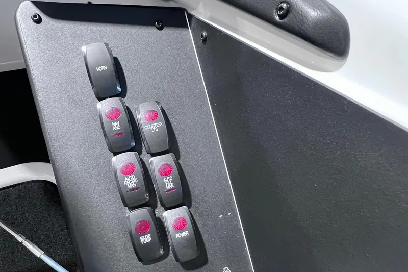 Slide: The Image of Control panel of 2026 Skeeter ZXR20 SE boat with labeled switches. - 13