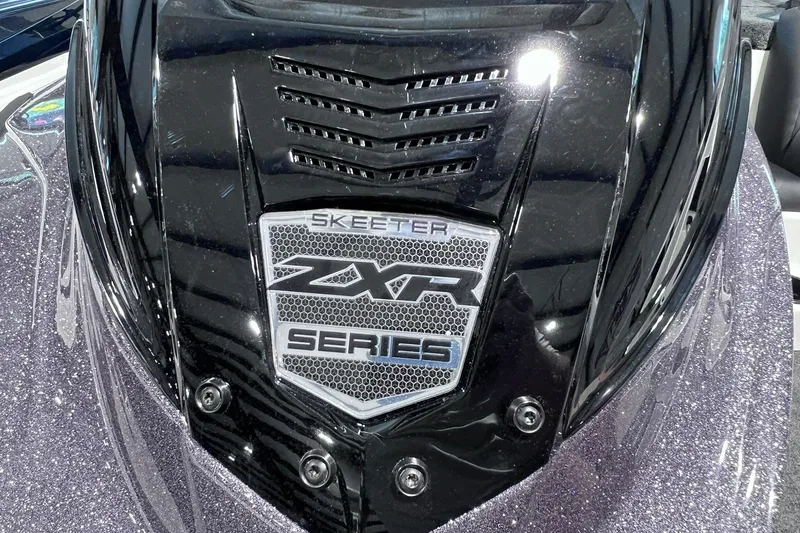 Slide: The Image of 2026 Skeeter ZXR20 SE boat badge with sleek black design and vent details. - 7