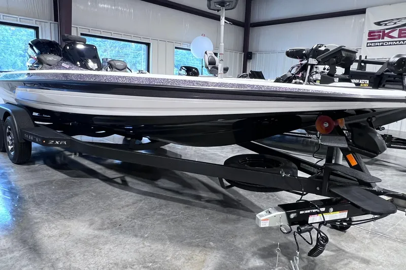 The Image of 2026 Skeeter ZXR20 SE boat on trailer in showroom setting. - 1