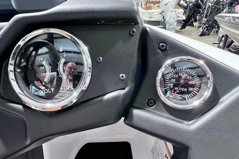 Slide: The Image of Dashboard of 2026 Skeeter ZXR20 SE showing volt, fuel, and water pressure gauges. - 14