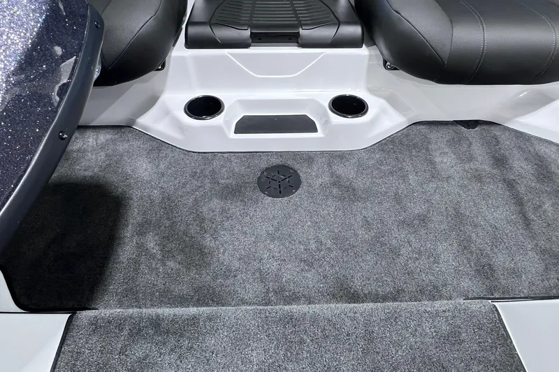 Slide: The Image of 2026 Skeeter ZXR20 SE boat interior with gray carpet and black seating. - 8