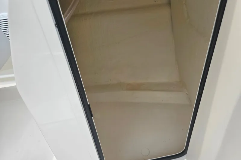 Slide: The Image of 2022 Bayliner VR4 Bowrider I/O storage compartment interior view. - 15