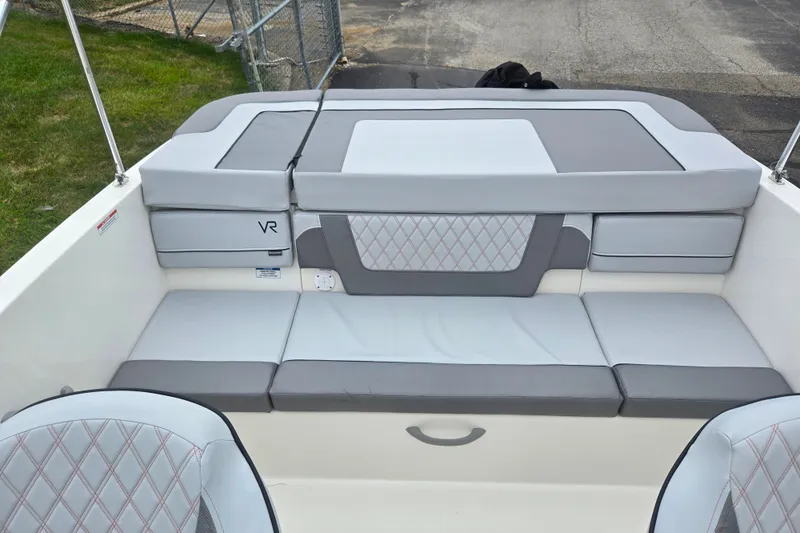 Slide: The Image of 2022 Bayliner VR4 Bowrider I/O interior with gray cushioned seating and diamond pattern accents. - 20