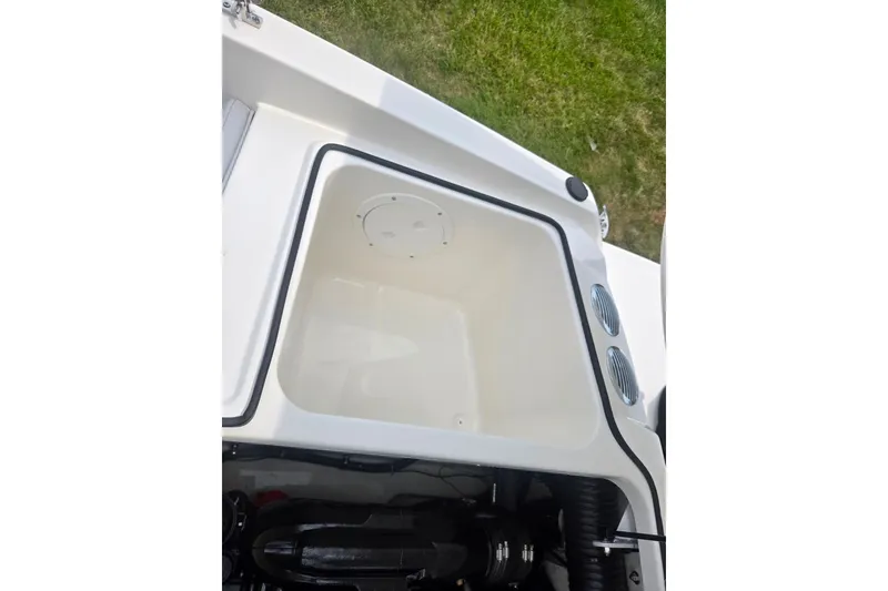 Slide: The Image of 2022 Bayliner VR4 Bowrider I/O storage compartment with engine view. - 23