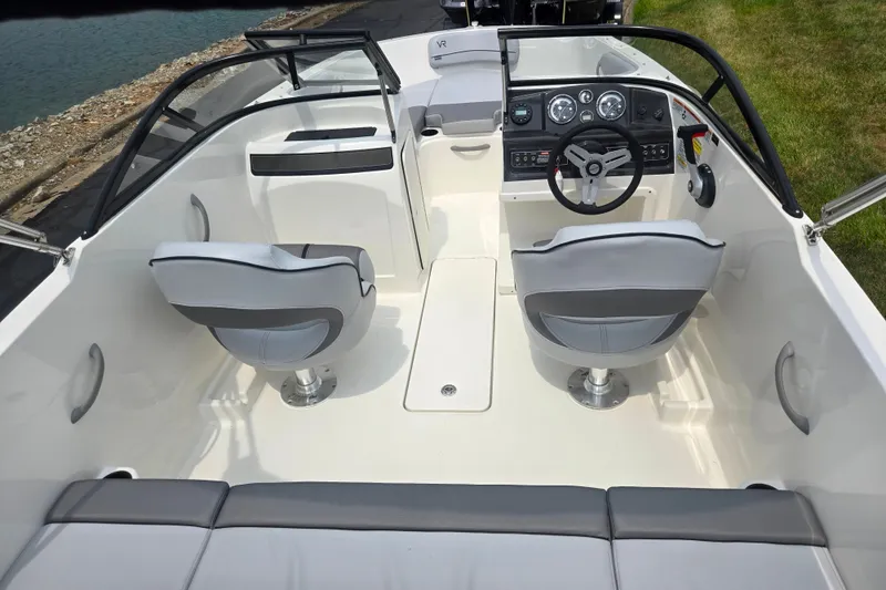 Slide: The Image of 2022 Bayliner VR4 Bowrider I/O interior with sleek seating and modern dashboard design. - 10