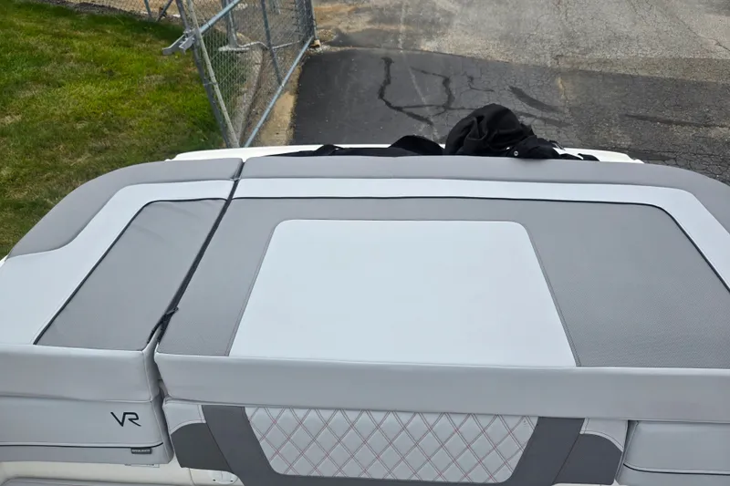 Slide: The Image of 2022 Bayliner VR4 Bowrider I/O boat with sleek gray seating and stylish design. - 21