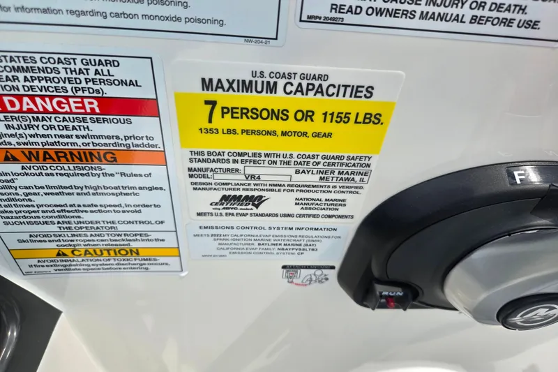 Slide: The Image of 2022 Bayliner VR4 Bowrider I/O capacity label, 7 persons or 1155 lbs, safety warnings. - 14