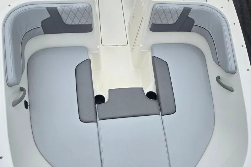 Slide: The Image of 2022 Bayliner VR4 Bowrider I/O interior with gray cushioned seating and cup holders. - 17