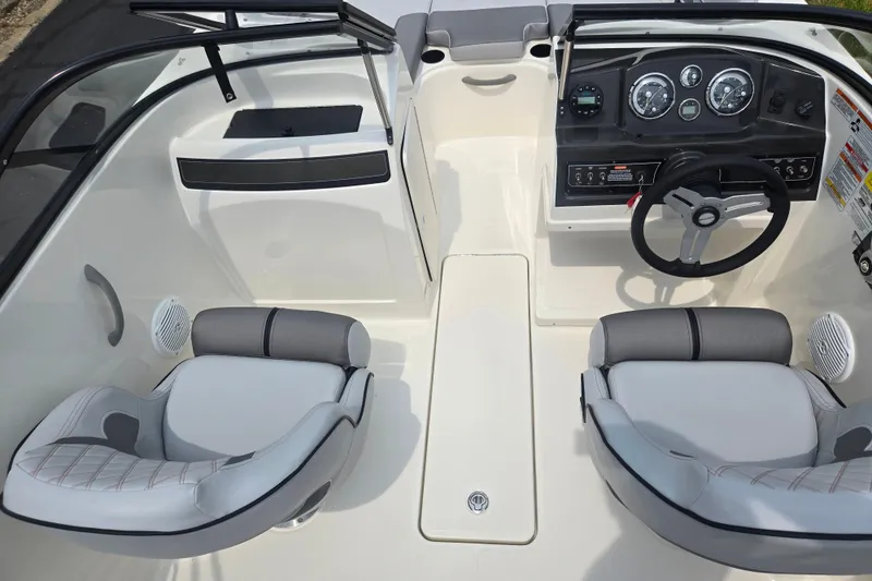 Slide: The Image of 2022 Bayliner VR4 Bowrider I/O interior with dual seats and modern dashboard. - 11