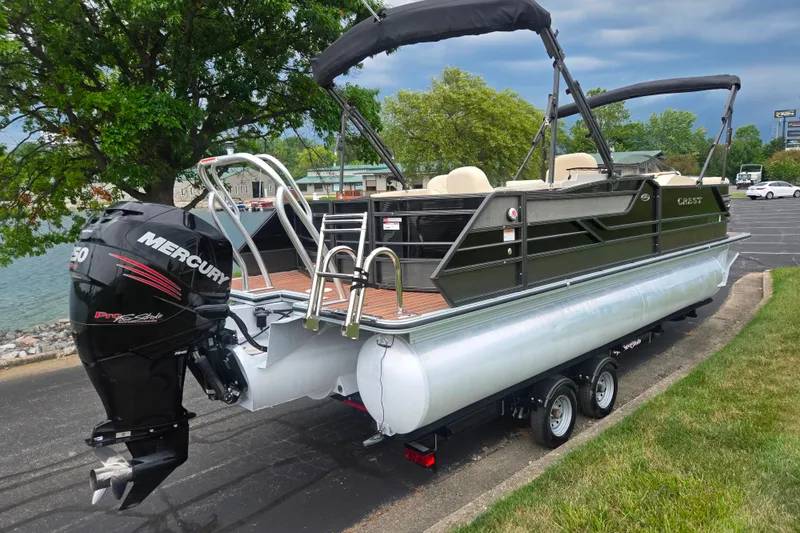 Slide: The Image of 2016 Crest Classic 230 Chateau pontoon boat with Mercury engine on trailer. - 1