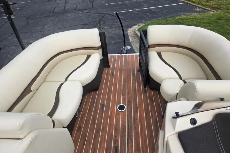 Slide: The Image of Luxurious seating on 2016 Crest Classic 230 Chateau boat with elegant wood flooring. - 27