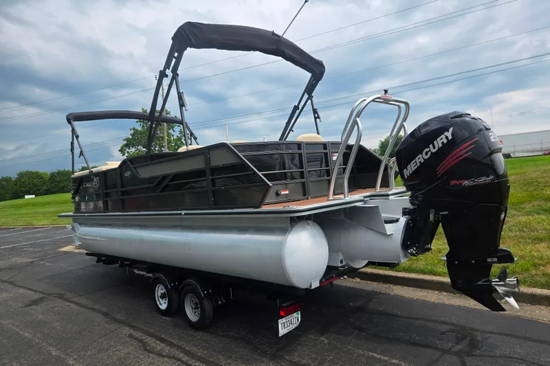 Slide: The Image of 2016 Crest Classic 230 Chateau pontoon boat with Mercury outboard motor on trailer. - 3