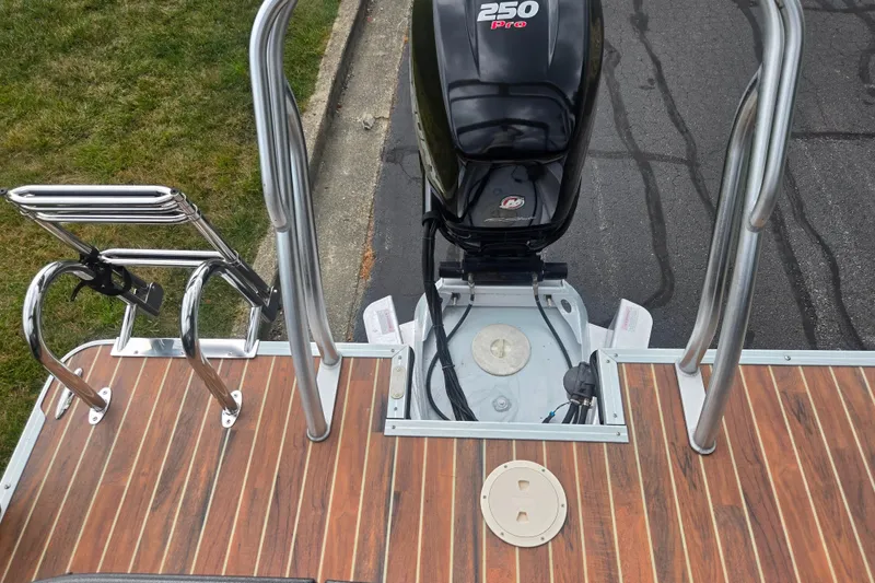 Slide: The Image of 2016 Crest Classic 230 Chateau boat with powerful 250 Pro motor and sleek wooden deck. - 20