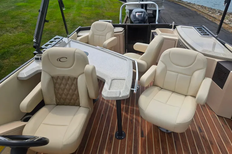 Slide: The Image of Luxurious interior of 2016 Crest Classic 230 Chateau pontoon boat with plush seating and elegant design. - 14