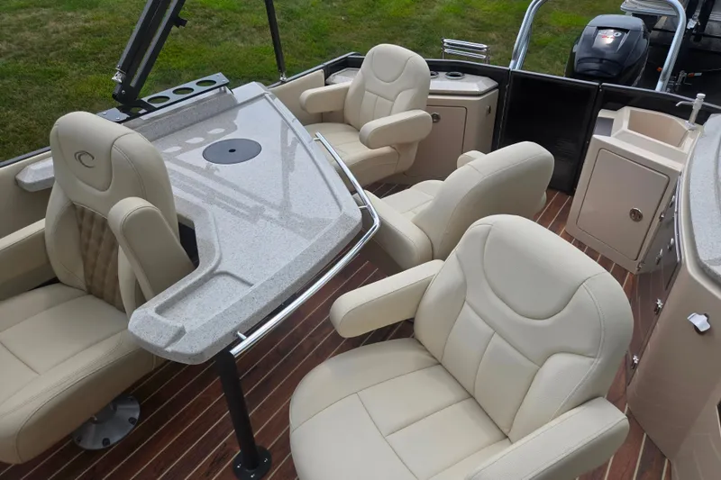 Slide: The Image of Luxurious interior of 2016 Crest Classic 230 Chateau pontoon boat with plush seating and sleek design. - 16