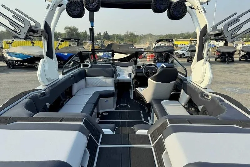 Slide: The Image of 2027 Supra R225 boat interior with modern seating and advanced audio system. - 10