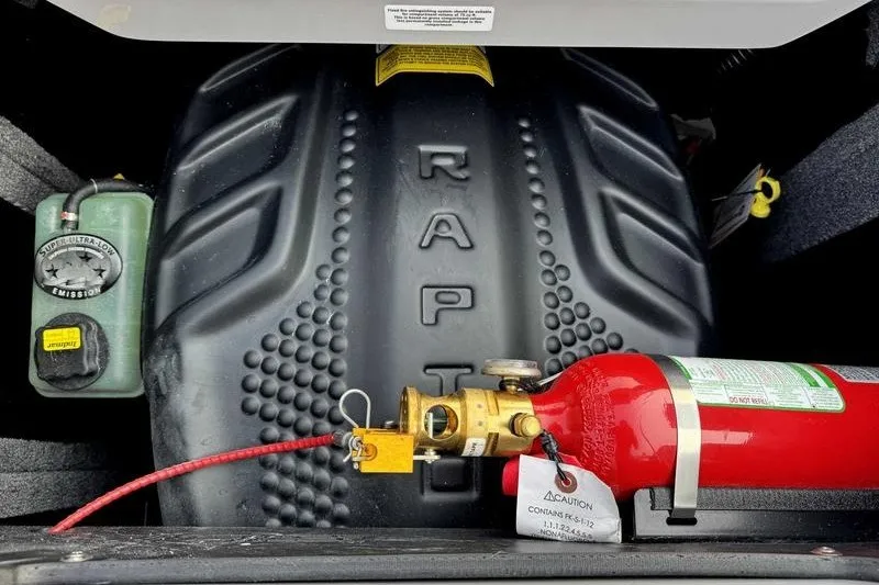 Slide: The Image of Engine compartment of a 2027 Supra R225 with Raptor branding and fire extinguisher. - 3