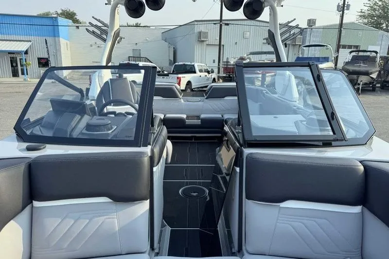 Slide: The Image of Interior of a 2027 Supra R225 boat with modern seating and dashboard. - 6