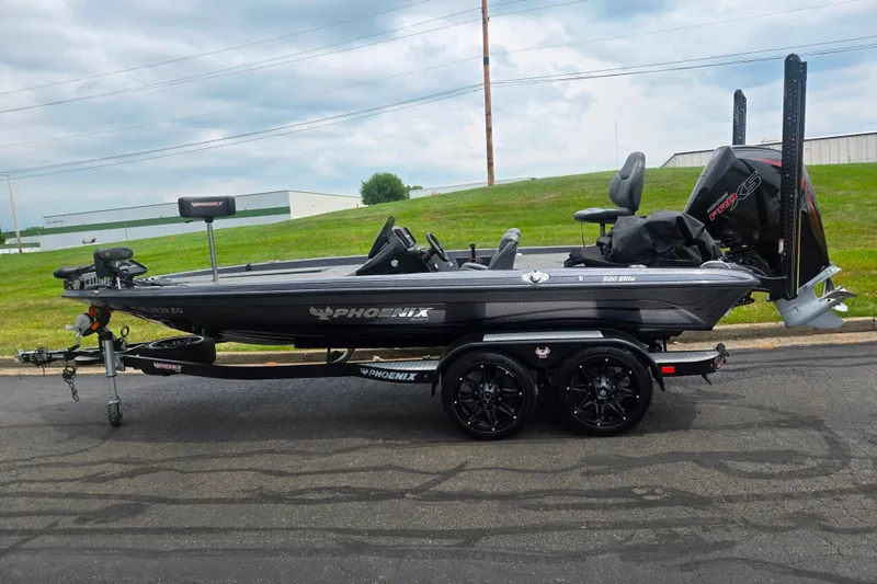 Slide: The Image of 2021 Phoenix 920 Elite fishing boat on trailer, parked outdoors. - 4