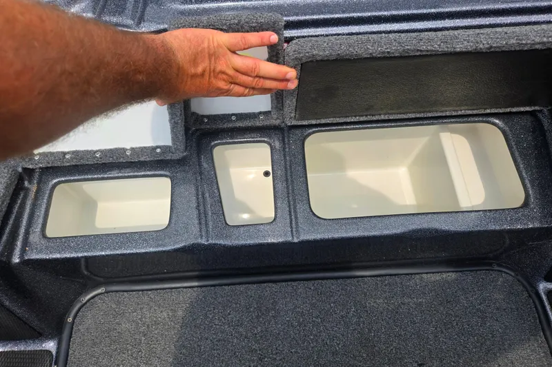 Slide: The Image of Interior compartments of a 2021 Phoenix 920 Elite boat, showcasing storage spaces. - 15