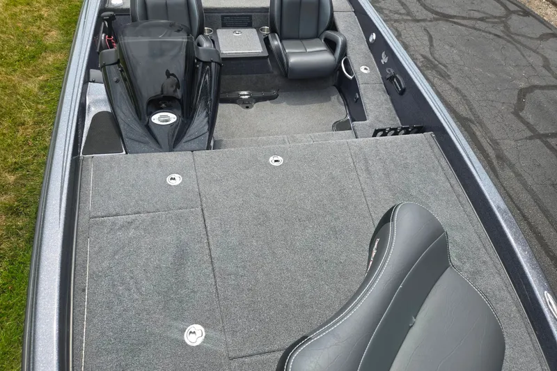 Slide: The Image of 2021 Phoenix 920 Elite boat interior with gray seating and carpeted deck. - 19