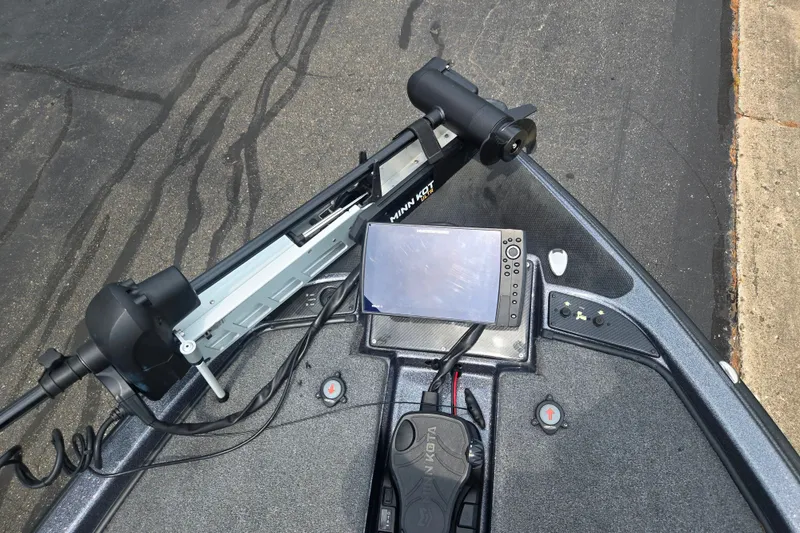 Slide: The Image of 2021 Phoenix 920 Elite boat dashboard with navigation system and trolling motor. - 18