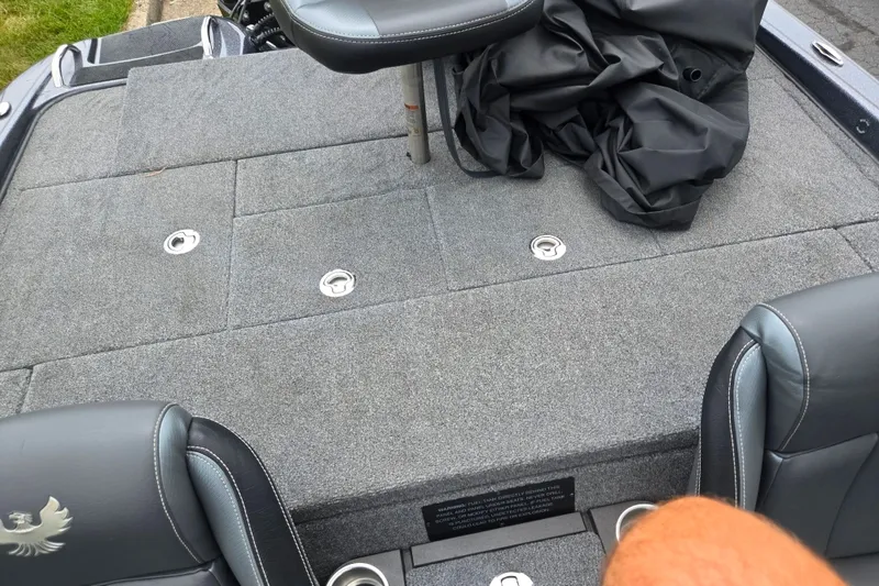 Slide: The Image of 2021 Phoenix 920 Elite boat deck with gray carpet and seating. - 23