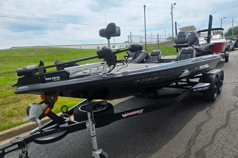 Slide: The Image of 2021 Phoenix 920 Elite fishing boat on trailer, featuring Minn Kota Ultrex motor. - 6
