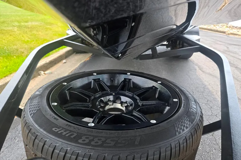 Slide: The Image of 2021 Phoenix 920 Elite trailer with black alloy wheel and tire on pavement. - 8