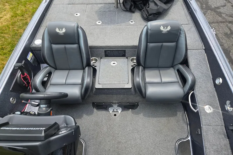 Slide: The Image of 2021 Phoenix 920 Elite boat interior with dual gray seats and steering console. - 21