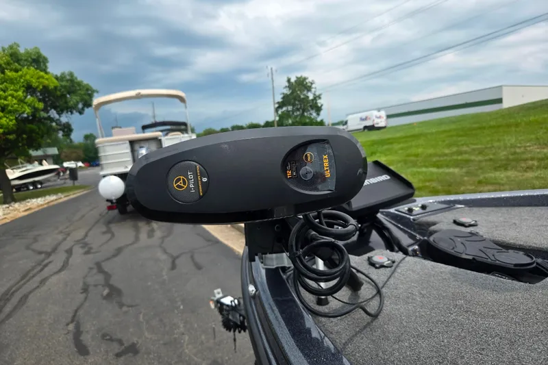 Slide: The Image of 2021 Phoenix 920 Elite boat with Minn Kota Ultrex trolling motor on a paved road. - 5