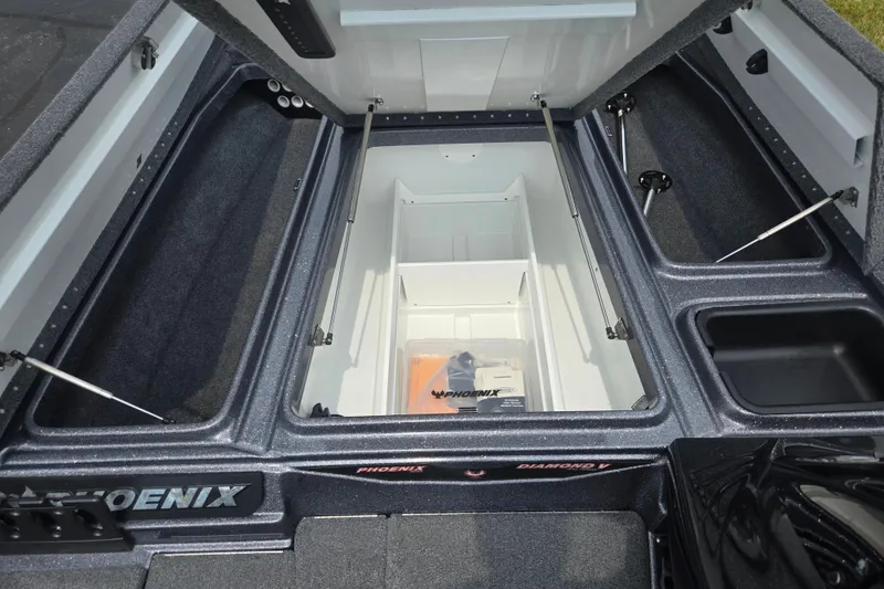 Slide: The Image of Open storage compartments of a 2021 Phoenix 920 Elite boat, showcasing spacious interior design. - 17