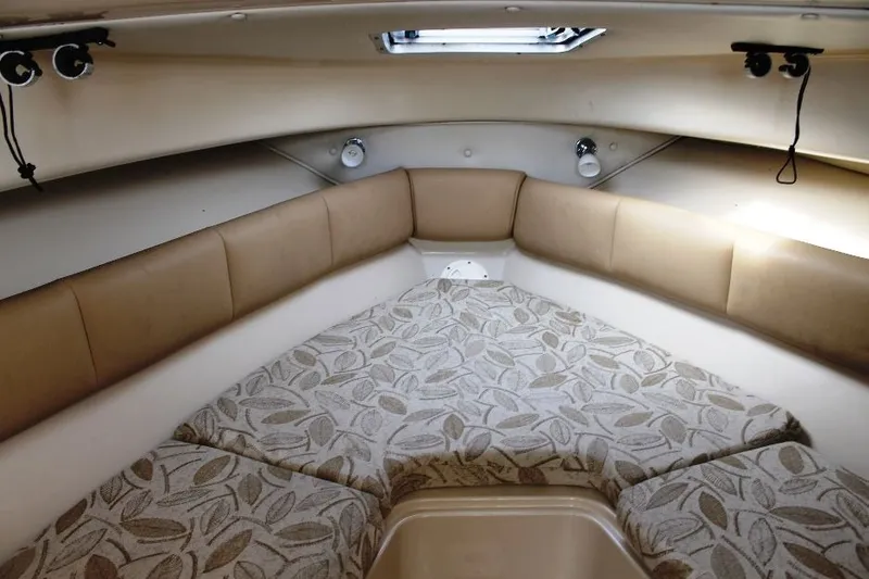 Slide: The Image of 2006 Robalo R265 Walkaround cabin interior with cushioned seating and patterned upholstery. - 17