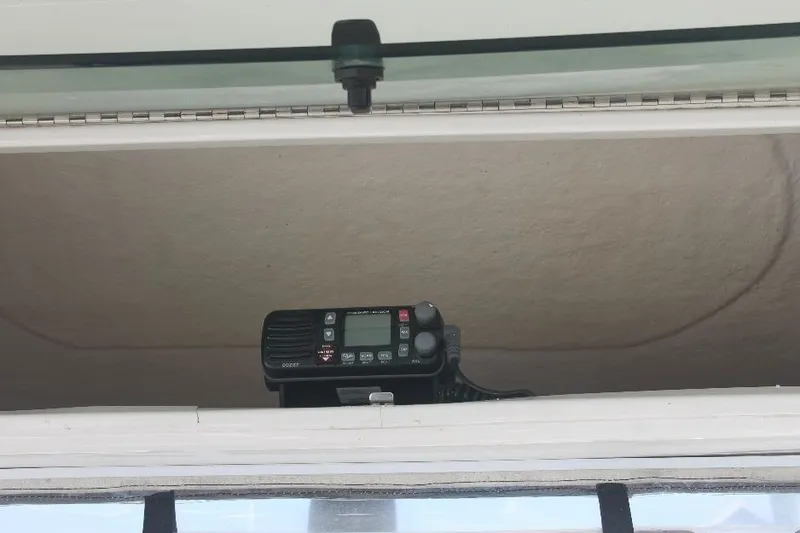 Slide: The Image of VHF radio inside a 2006 Robalo R265 Walkaround boat cabin. - 23