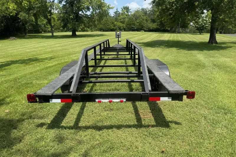 Slide: The Image of Trailer for 2011 Catamaran Cruisers Lil Hobo 31 on grassy field. - 47