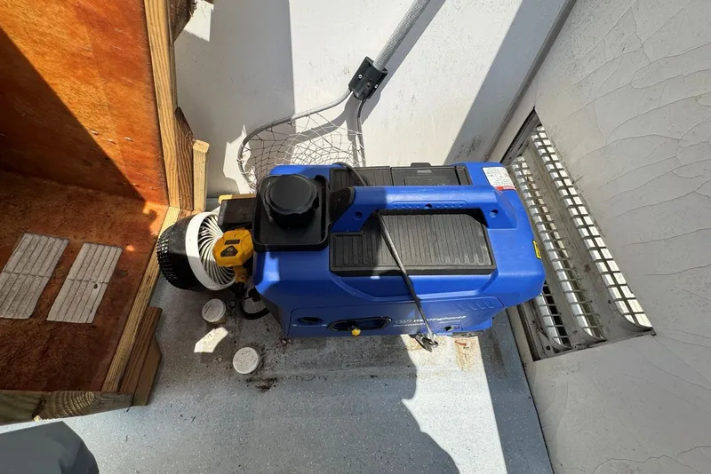 Slide: The Image of Blue generator on Catamaran Cruisers Lil Hobo 31, 2011 model, in a storage compartment. - 38